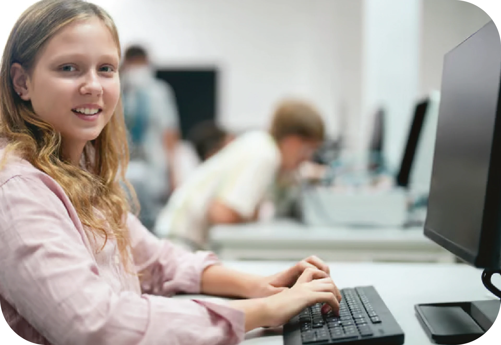 Spera Partners systems analyst providing technical support for student devices in a Pittsburgh classroom setting.