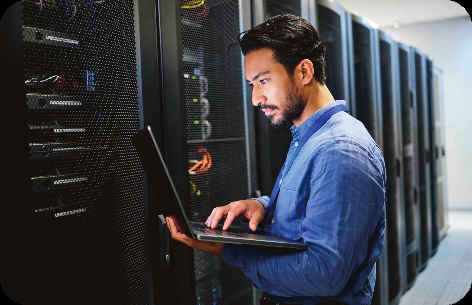 Spera Partners network engineer performing proactive server maintenance in a Pittsburgh school server room.