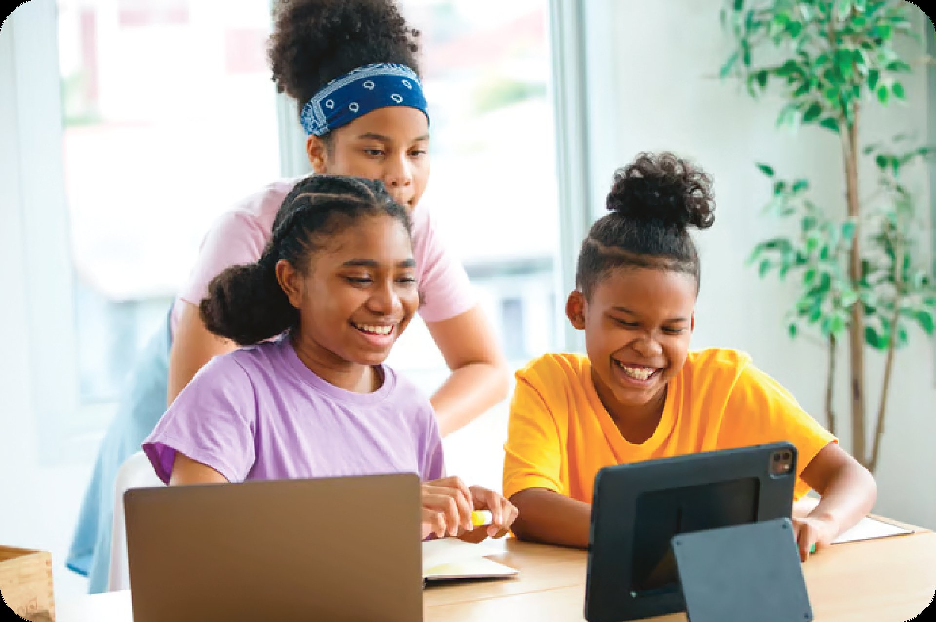 Young students collaborating with integrated classroom technology following a smooth Spera Partners large scale deployment.